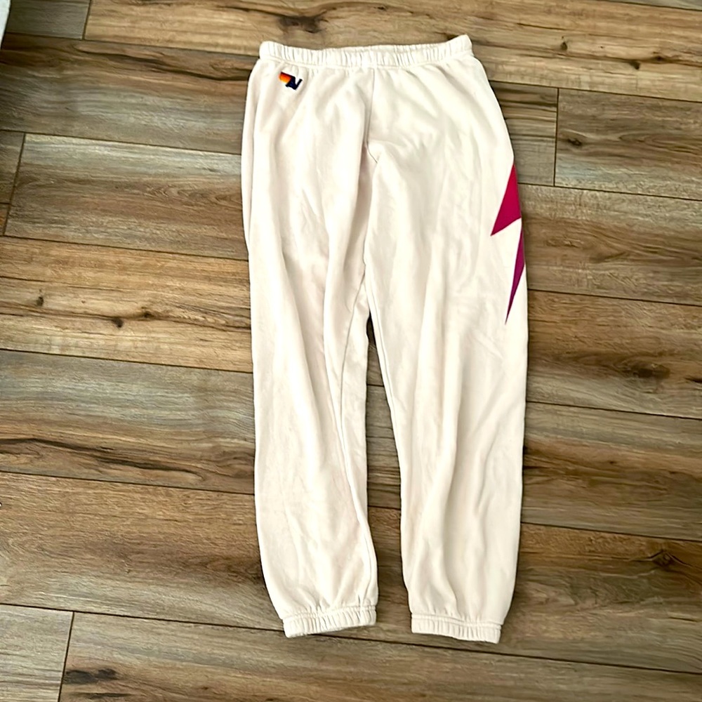 cream aviator nation sweatpants with dark pink lightning bolt